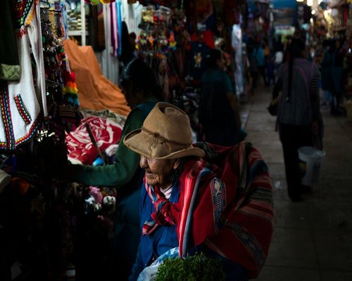 Local peruvian market, person carrying a light bag